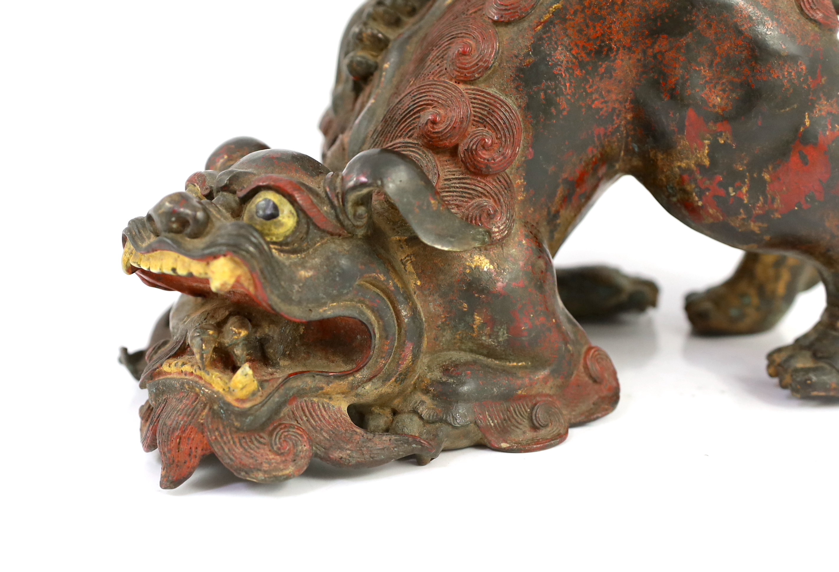 A large Japanese gilt and red lacquered bronze ‘shi-shi’ koro and cover, Edo period